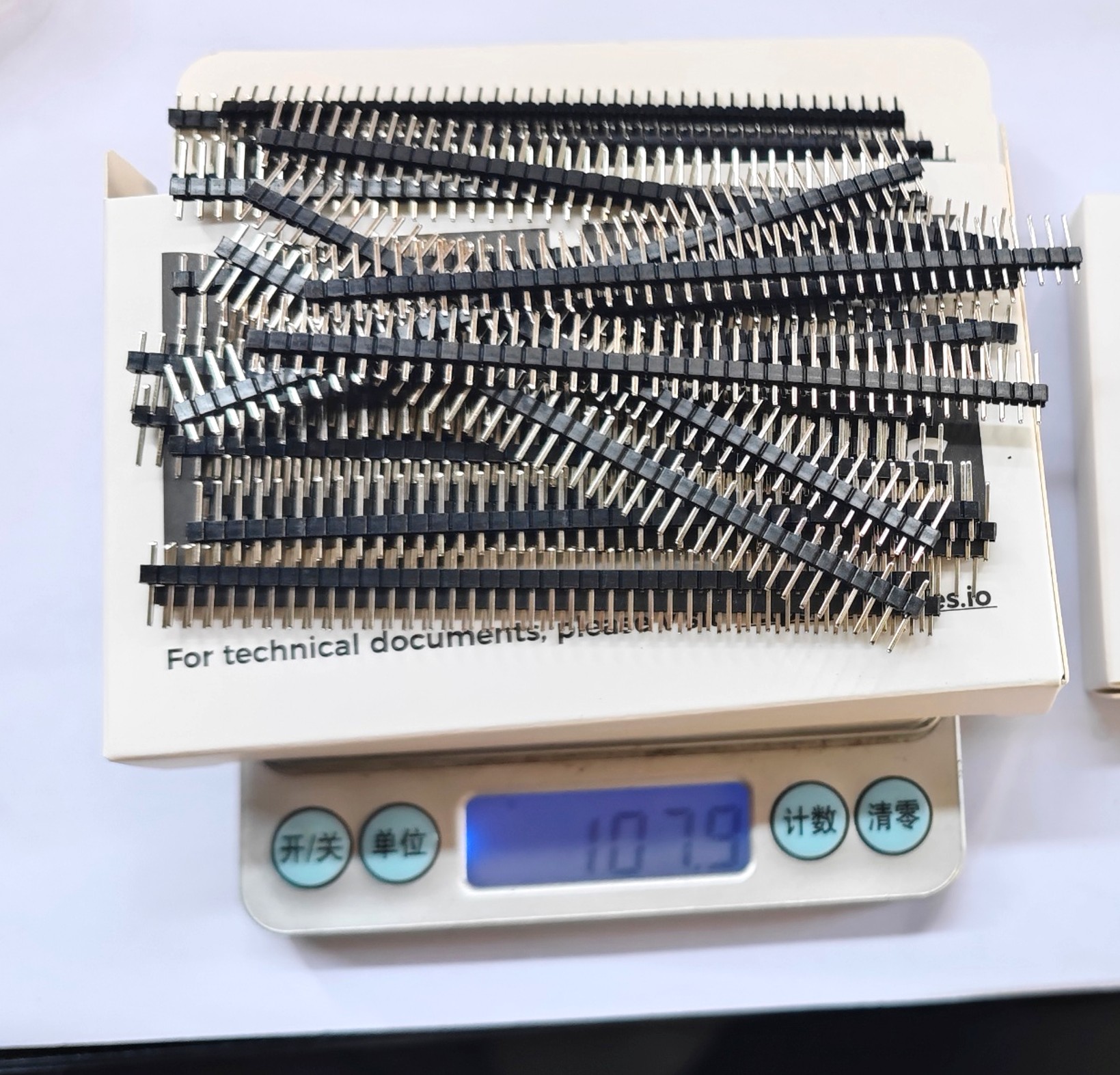 Male header pins inserted in breadboard demonstrating vertical straight connection