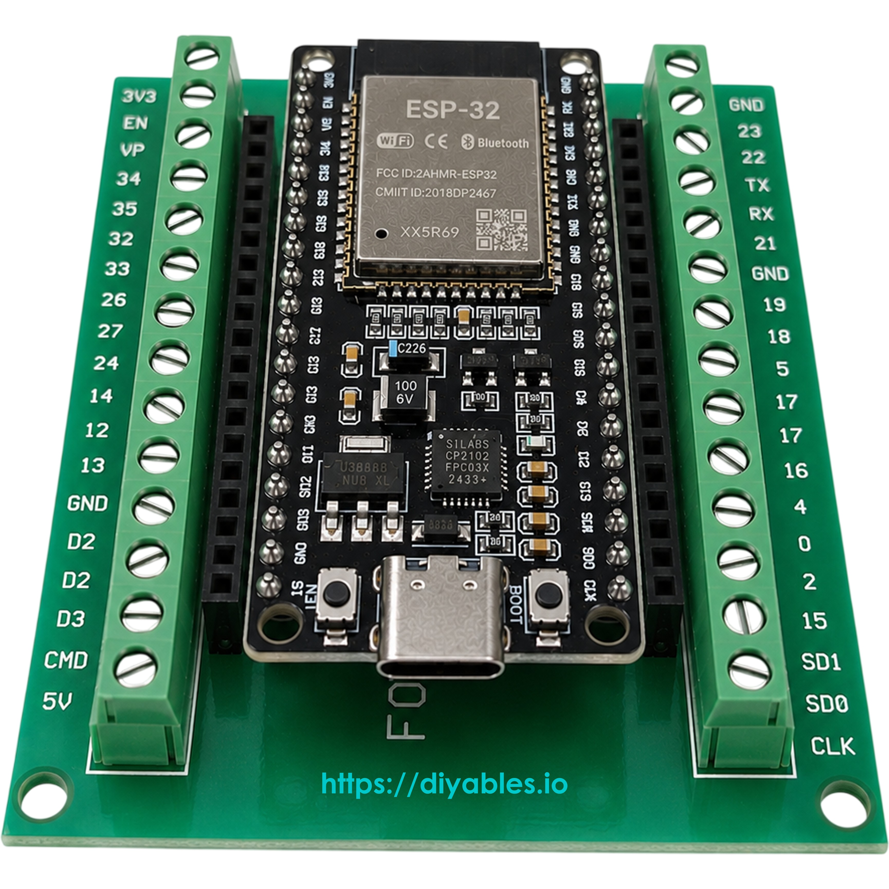 ESP32 38 pin wide board and screw terminal breakout board angled view showing CP2102 chip and terminal blocks