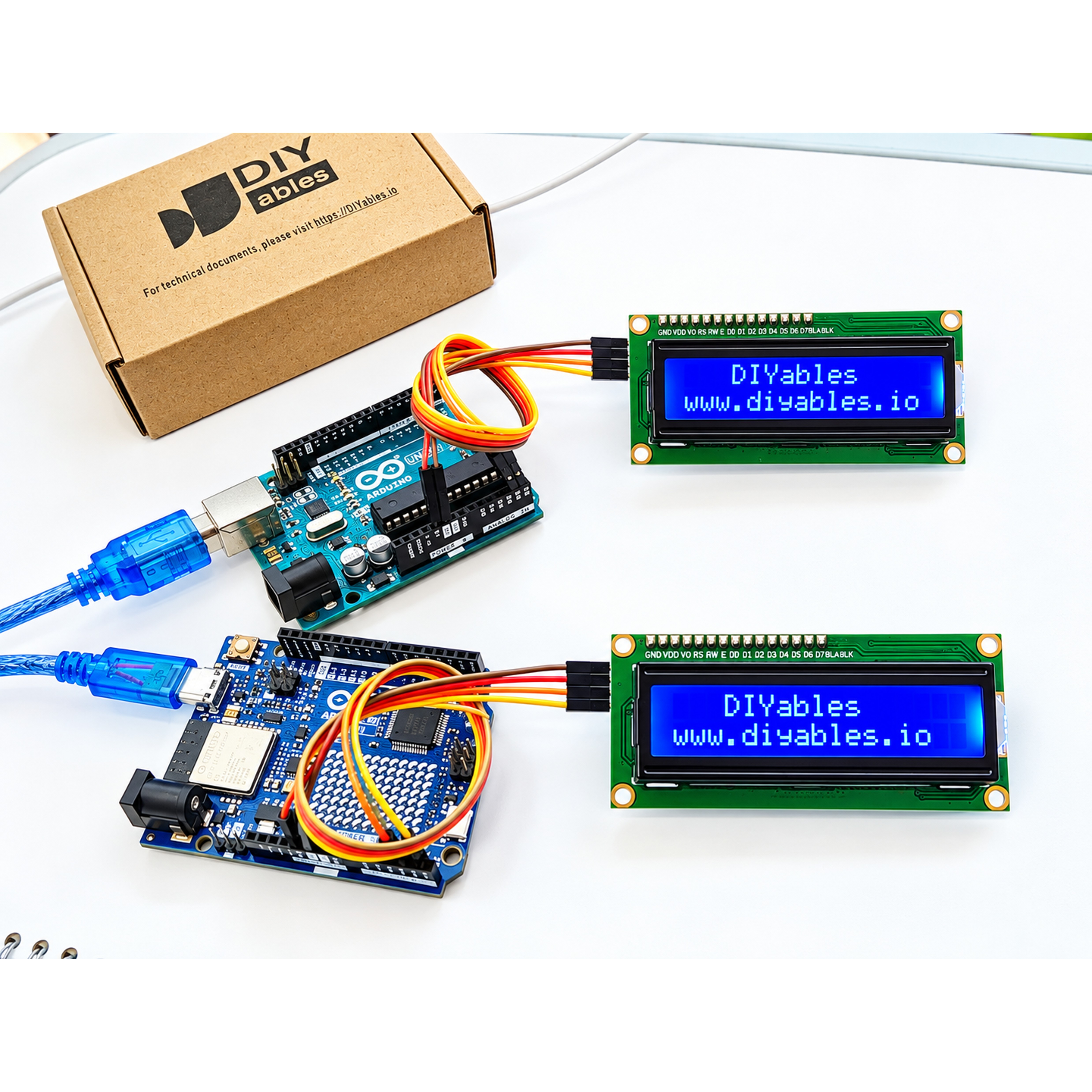 Two blue 16x2 I2C LCD displays wired to Uno boards showing DIYables text